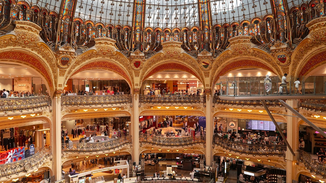 Ornate interior of a grand department store with multiple levels.