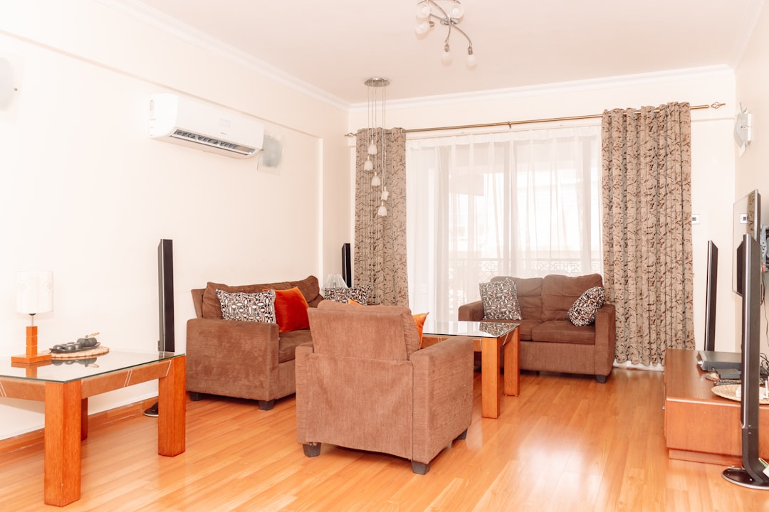 a living room filled with furniture and a flat screen tv