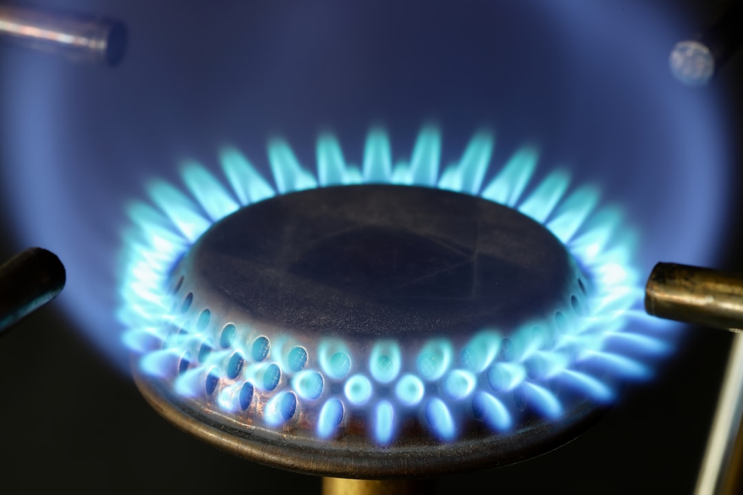A close up of a blue flame on a stove