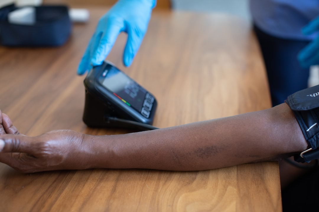 a hand holding a smart watch